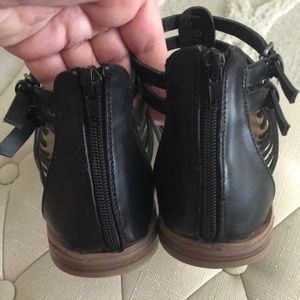 Woman’s black gladiator sandals